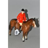 A BESWICK HUNTSMAN FIGURE, model no 1501, style two : standing, the huntsman wearing a red jacket