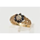 A 9CT GOLD DIAMOND AND SAPPHIRE CLUSTER RING, the illusion set single cut diamond, within a circular