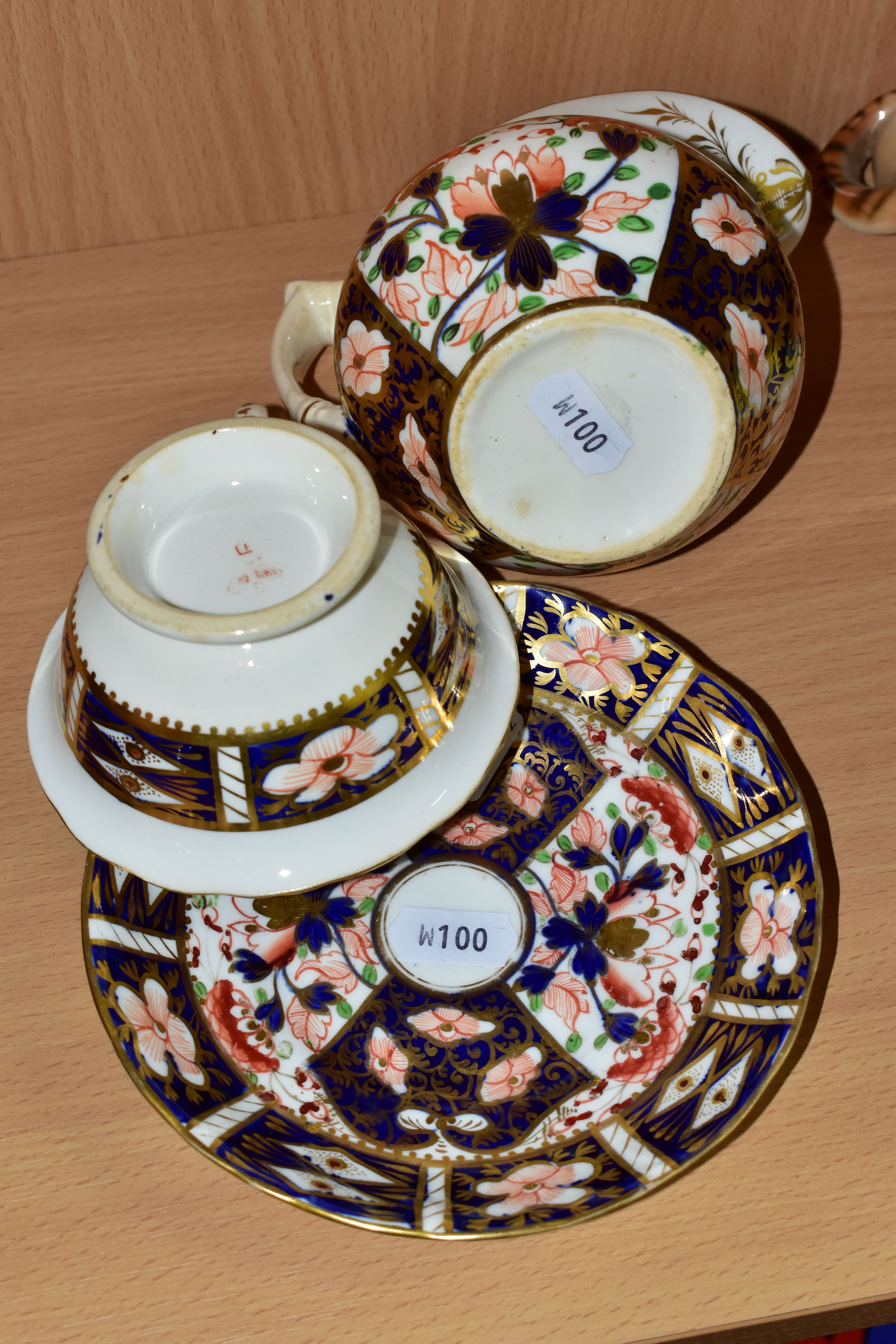 A NINETEENTH CENTURY ENGLISH TEACUP, SAUCER AND CREAM JUG, in an Imari pattern, the teacup having - Image 4 of 4