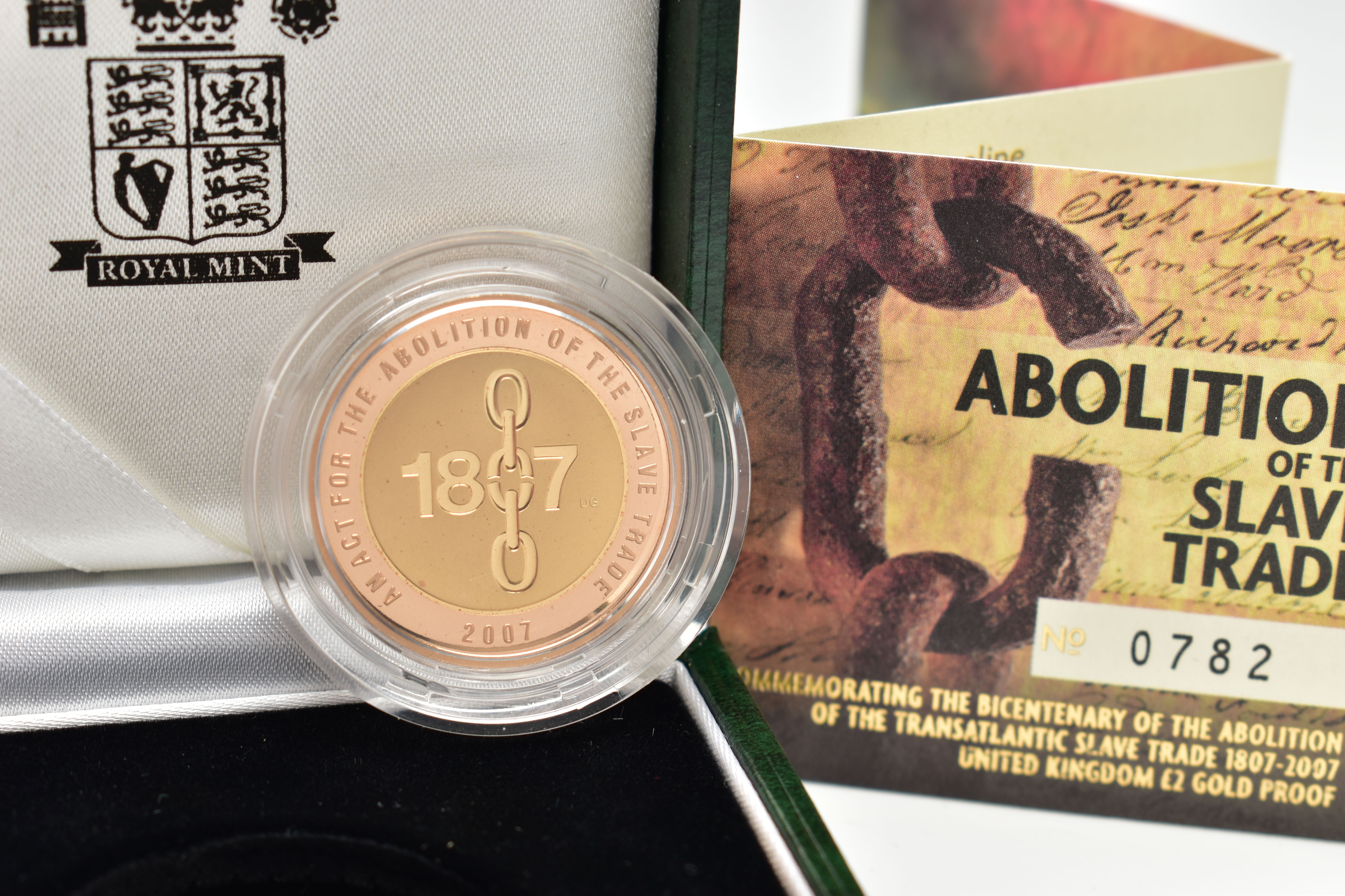 A ROYAL MINT 2007 GOLD PROOF ABOLITION OF THE SLAVE TRADE TWO POUND COIN, with red and yellow gold