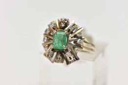 A 1970s EMERALD AND DIAMOND CLUSTER RING, of geometric design, set with a principal rectangular