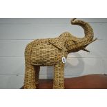 A WICKER FIGURE IN THE SHAPE OF A BELLOWING ELEPHANT, length approximately 60cm x height