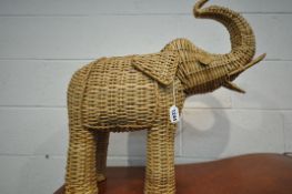 A WICKER FIGURE IN THE SHAPE OF A BELLOWING ELEPHANT, length approximately 60cm x height