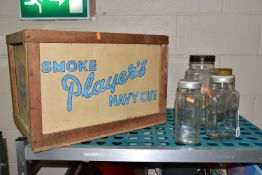 A PLAYERS NAVY CUT CIGARETTE PACKING CASE, approximate size H39 x W57 x D39cm, lacking its lid,