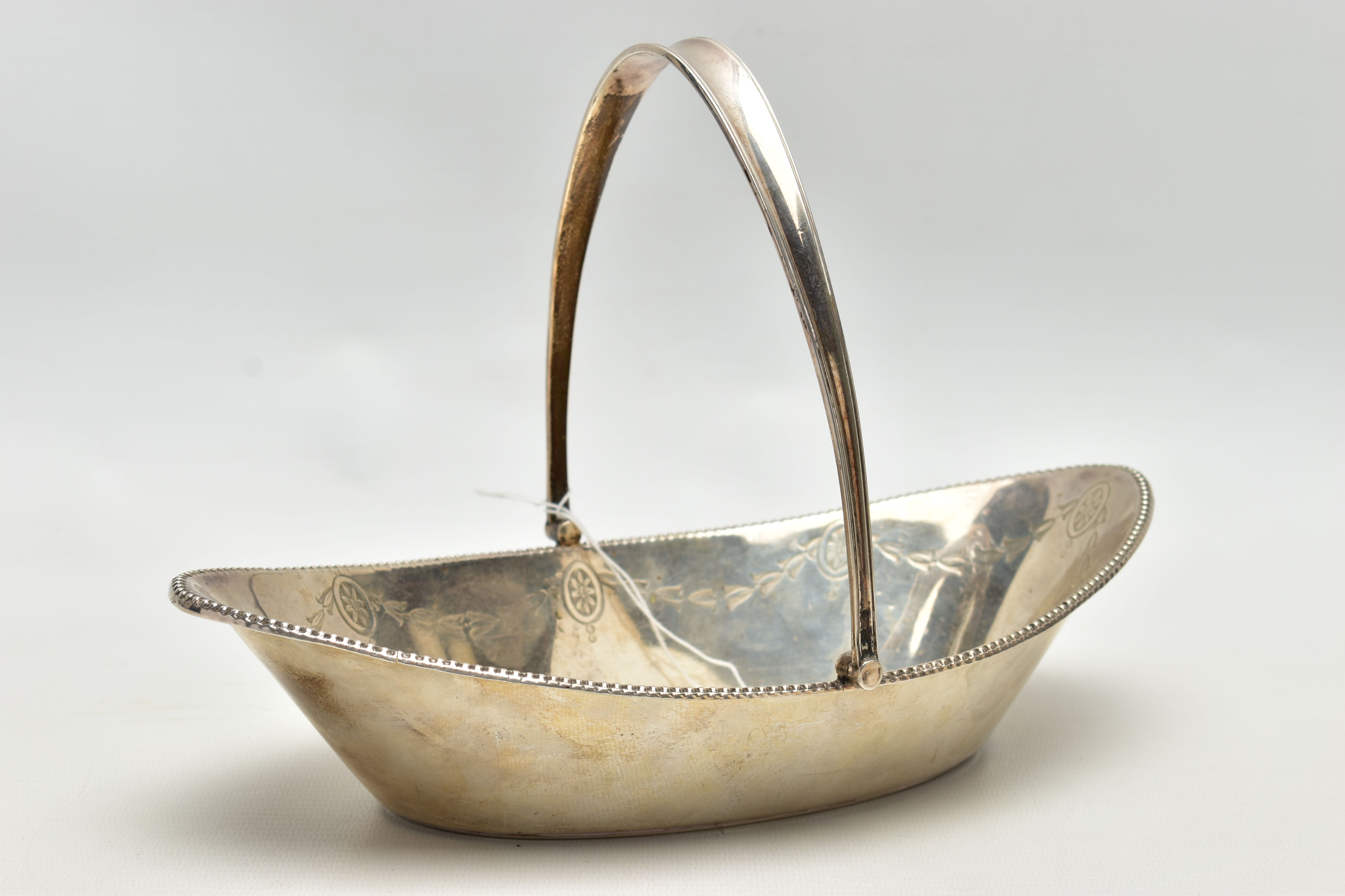 A SILVER BASKET, a boat shaped dish, engraved with floral detail, fitted with a tapered handle, - Image 2 of 8