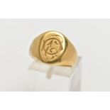 A YELLOW METAL SIGNET RING, oval form with monogram engraving, inside band engraved 'Septembre