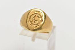 A YELLOW METAL SIGNET RING, oval form with monogram engraving, inside band engraved 'Septembre