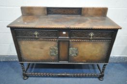 A 20TH CENTURY OAK SIDEBOARD, with a raised back, two drawers over two cupboard doors, on barley