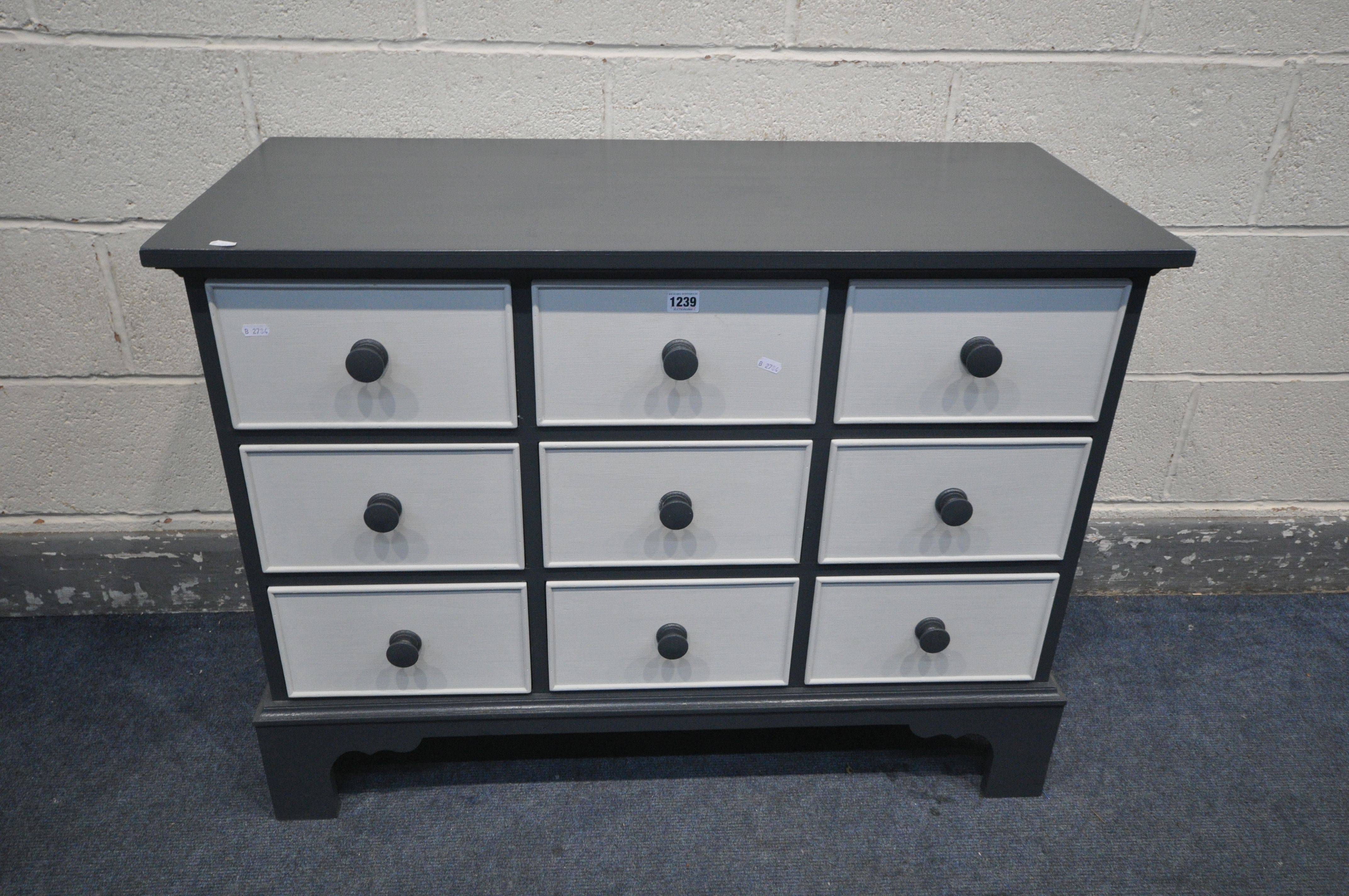 A BESPOKE PAINTED SIDEBOARD/CHEST OF NINE DRAWERS, on bracket feet, width 99cm x depth 45cm x height