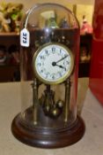 A GLASS DOMED ANNIVERSARY CLOCK, columns, crown and pendulum with brass application , wooden