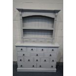 A GREY PAINTED NARROW CHEST OF FOURTEEN DRAWERS, width 122cm x depth 28cm x 90cm, and a painted