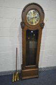 AN EARLY 20TH CENTURY OAK LONGCASE CLOCK, with a rounded top, single long glazed door enclosing a