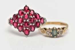 TWO GEM SET RINGS, the first a large marquise shape ring set with sixteen oval cut garnets, each