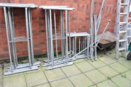 A GALVANISED STEEL TOWER SCAFFOLD with 16 panels 130cm wide, 5 65cm wide panels, 15 ties and a