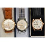 THREE GENTS WRISTWATCHES, to include a yellow metal Omega Automatic, round champagne dial signed '