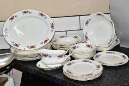 A TWENTY NINE PIECE SAINT JAMES CHINA DINNER SERVICE, comprising a sauceboat and stand, a meat