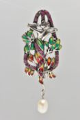 A WHITE METAL PLIQUE A JOUR BROOCH, art Noveau style, displaying a lady within flowers, set within a