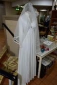 A VINTAGE WEDDING DRESS, from the Princess Collection by Ronald Joyce, size 12, long sleeved,