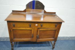 AN ART DECO OAK MIRRORBACK SIDEBOARD, with two drawers, width 120cm x depth 46cm x height 122cm (