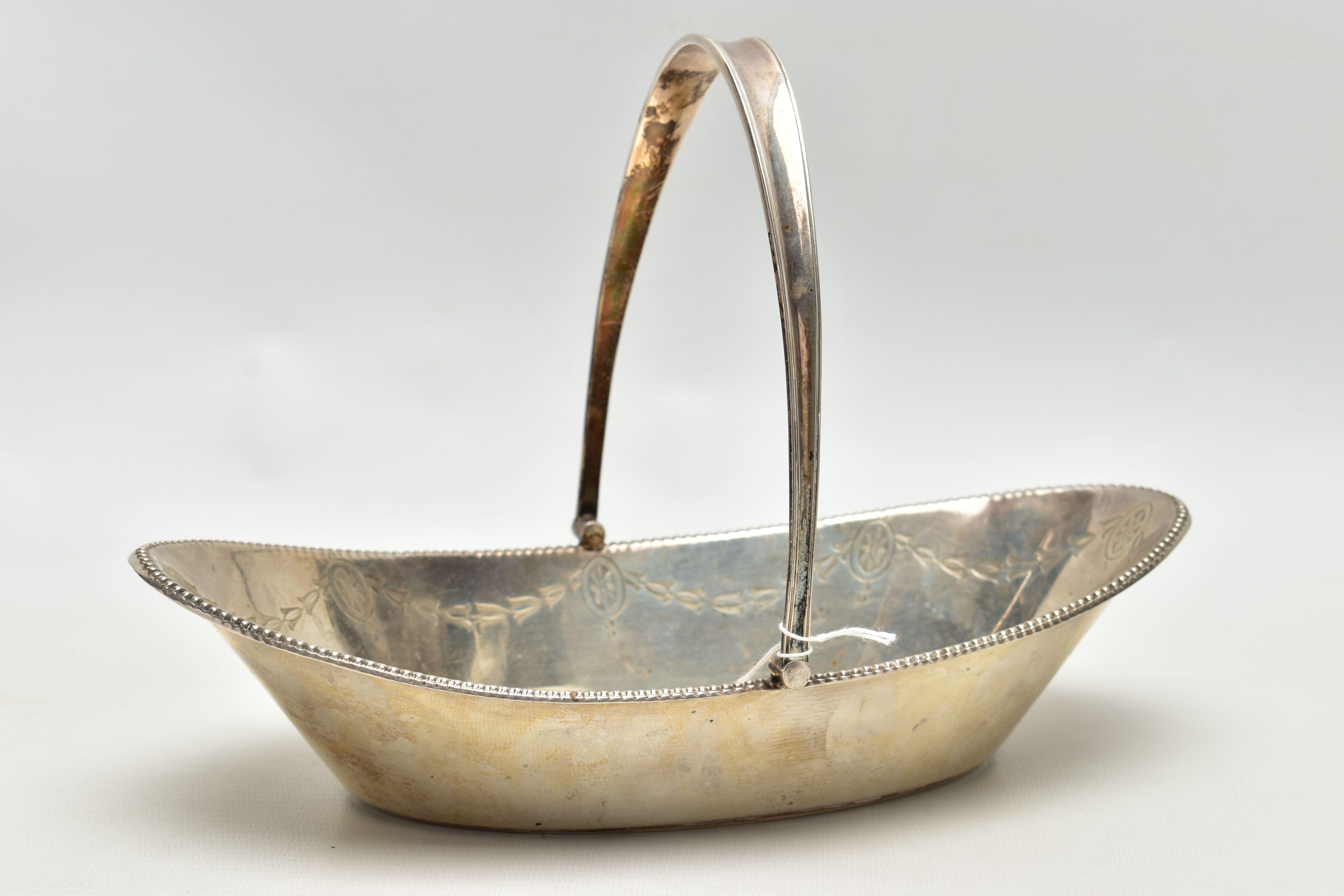 A SILVER BASKET, a boat shaped dish, engraved with floral detail, fitted with a tapered handle, - Image 3 of 8