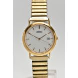 A 9CT GOLD 'SEIKO' WRISTWATCH, a quartz movement, round white dial, signed 'Seiko', baton markers,