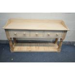 A BESPOKE DRESSER BASE, with a raised back, three various drawers, and an undershelf, length 158cm x
