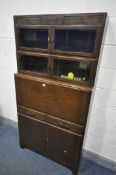 AN OAK SECTIONAL BOOKCASE/BUREAU, the top two sections with double glazed doors, fall front