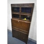 AN OAK SECTIONAL BOOKCASE/BUREAU, the top two sections with double glazed doors, fall front