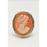 A 9CT GOLD SHELL CAMEO BROOCH/PENDANT, of an oval form depicting a lady in profile, collet set