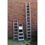 AN ALUMINIUM DOUBLE EXTENSION LADDER with 12 rungs to each 300cm length along with two sets of