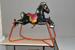 A 1960'S METAL ROCKING HORSE ON A SPRUNG FRAME, possibly by Mobo, height 90cm x length 101cm (