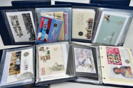FOUR ROYAL MAIL/ROYAL MINT PHILATELIC NUMISMATIC ALBUMS, to include from 1995 through to 2019,