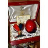 A BOXED ROYAL DOULTON FLAMBÉ EGG AND STAND, limited to a worldwide edition of 3500, this piece is