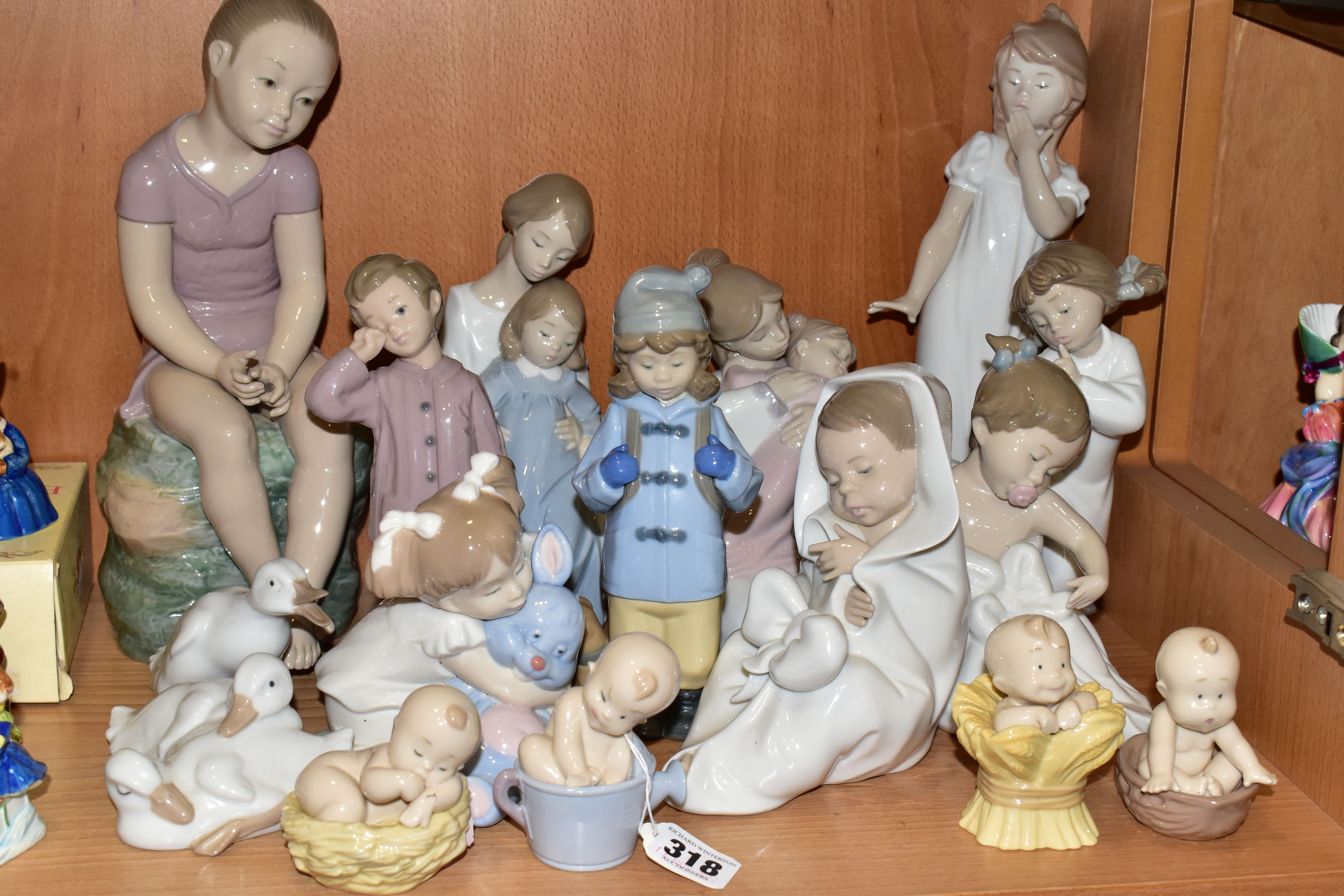 SIXTEEN LLADRO NAO FIGURINES, comprising four figures from the Where Do Babies Come From