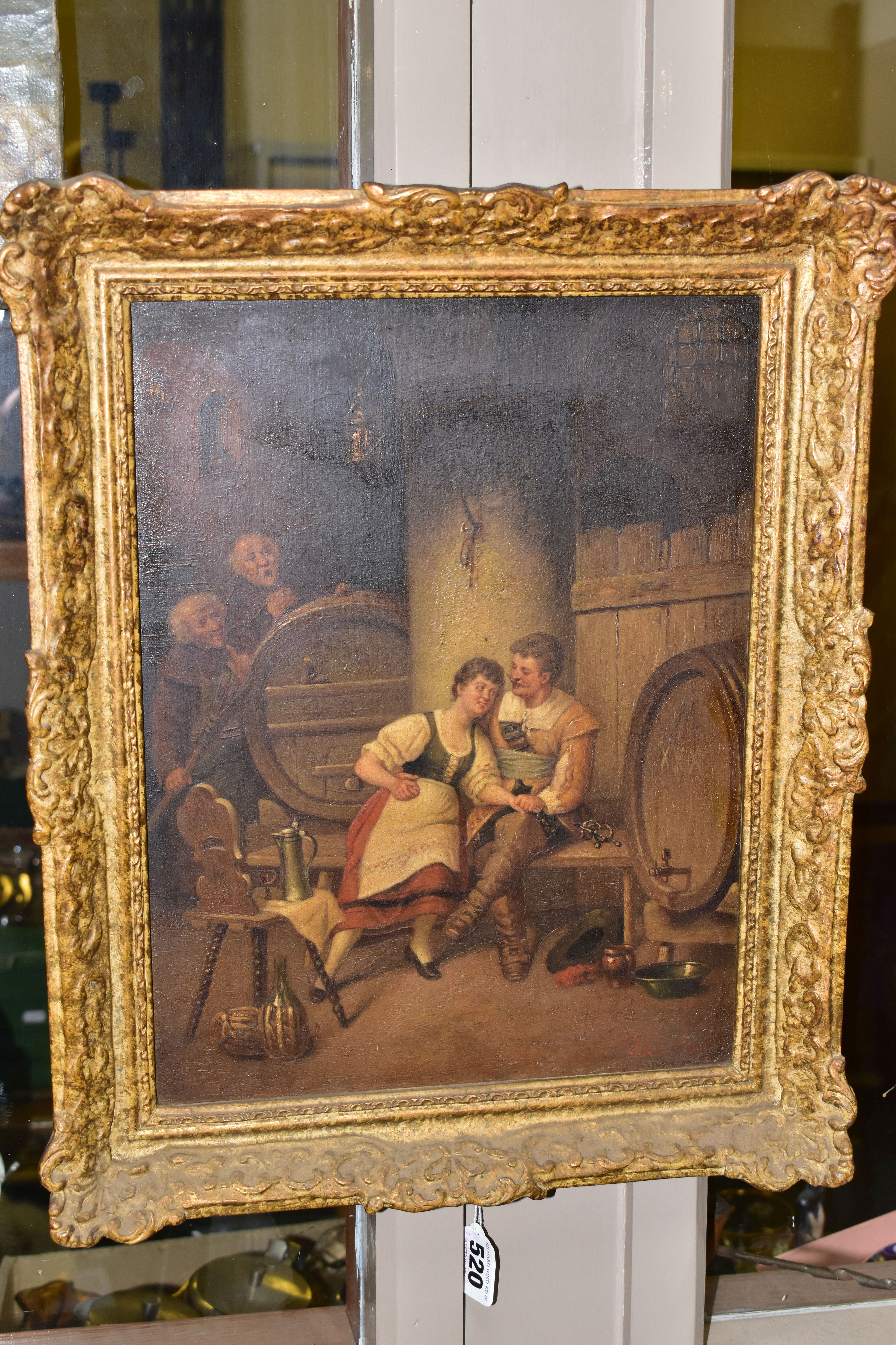 A LATE 19TH / EARLY 20TH CENTURY TAVERN SCENE, depicting a courting couple seated beside barrels,