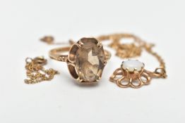A 9CT GOLD RING AND PENDANT, an oval cut smoky quartz, prong set with an open work scalloped