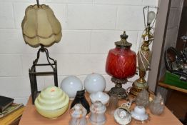 TWO VINTAGE TABLE LAMPS AND A GROUP OF ASSORTED GLASS SHADES, comprising a large green onyx and gilt