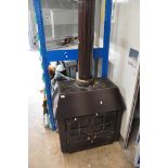 A VINTAGE ENAMELLED CAST IRON LOG BURNER with chimney, width 74cm height before chimney 79cm