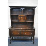 AN EARLY TO MID 20TH CENTURY OAK DRESSER, with an arrangement of shelves, above a base with two