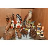 A GROUP OF EIGHT ASSORTED GOEBEL FIGURES AND FIVE CARVED WOOD ANIMALS, comprising a carved wood
