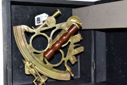 A Reproduction brass Sextant in a wooden box together with an Aristo Studio slide rule (1)