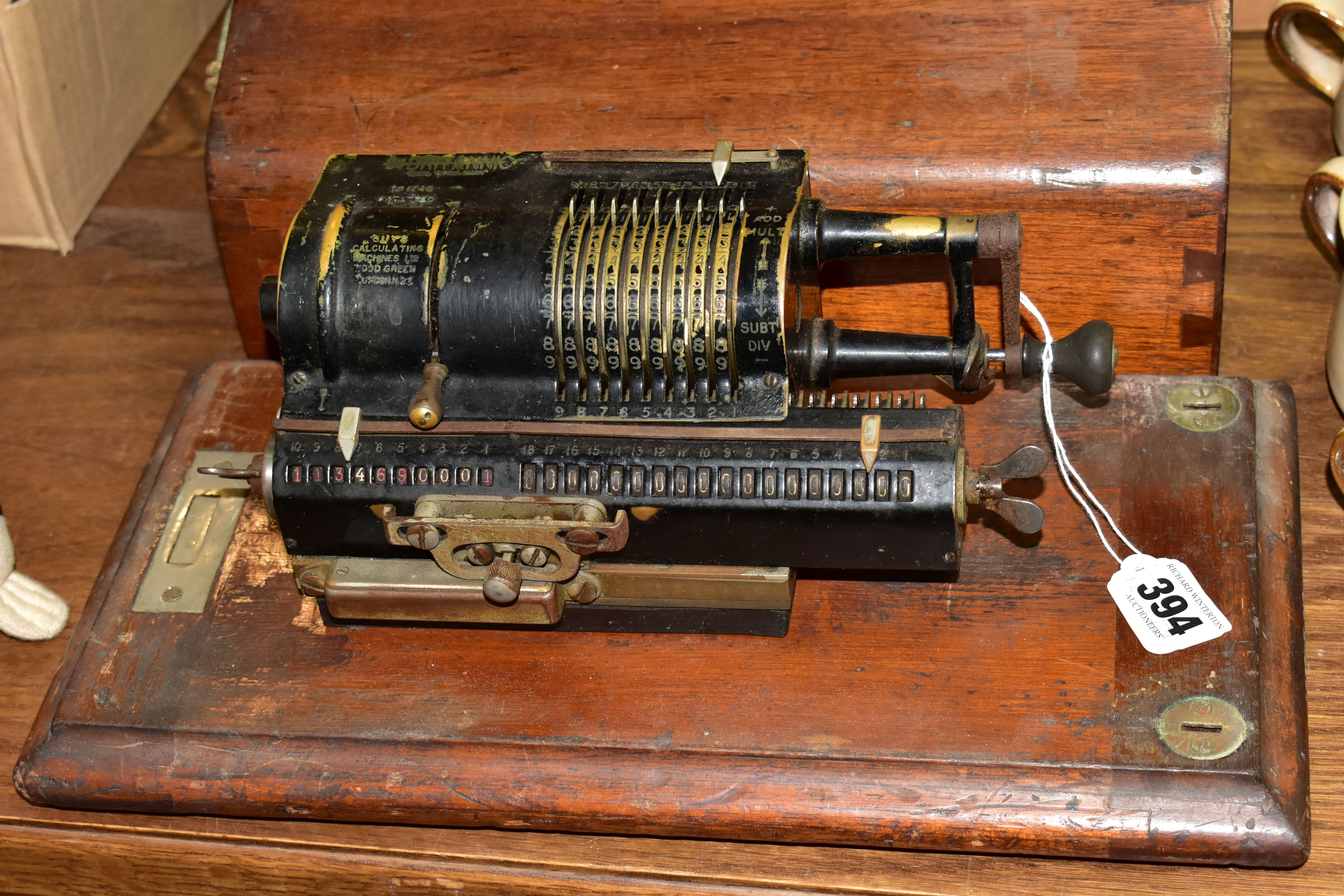 A GUYS BRITANNIC CALCULATING MACHINE, with wooden cover