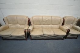 A CREAM LEATHER THREE PIECE LOUNGE SUITE, comprising a three seater sofa, length 182cm, a two seater