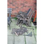 THREE PAIRS OF MODERN CAST IRON GARDEN BENCH ENDS, two matching back panels, and two wrought iron
