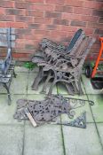 THREE PAIRS OF MODERN CAST IRON GARDEN BENCH ENDS, two matching back panels, and two wrought iron