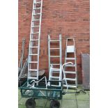 AN ALUMINIUM DOUBLE EXTENSION LADDER with 13 rungs to each 340cm length, two step ladders, a stand