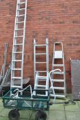 AN ALUMINIUM DOUBLE EXTENSION LADDER with 13 rungs to each 340cm length, two step ladders, a stand