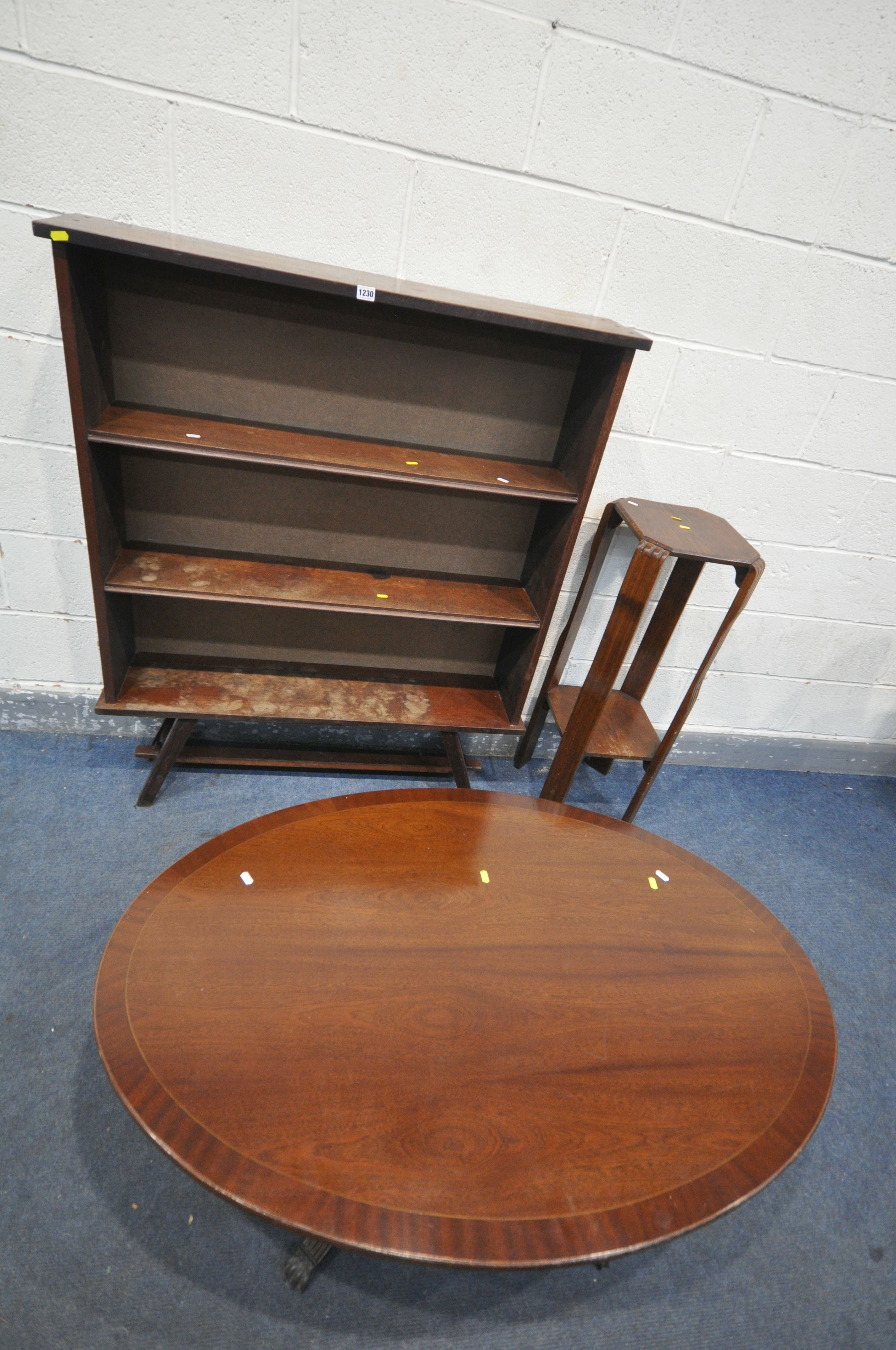 A MAHOGANY OPEN BOOKCASE, with two fixes shelves, on a trestle base, width 110cm x depth 26cm x