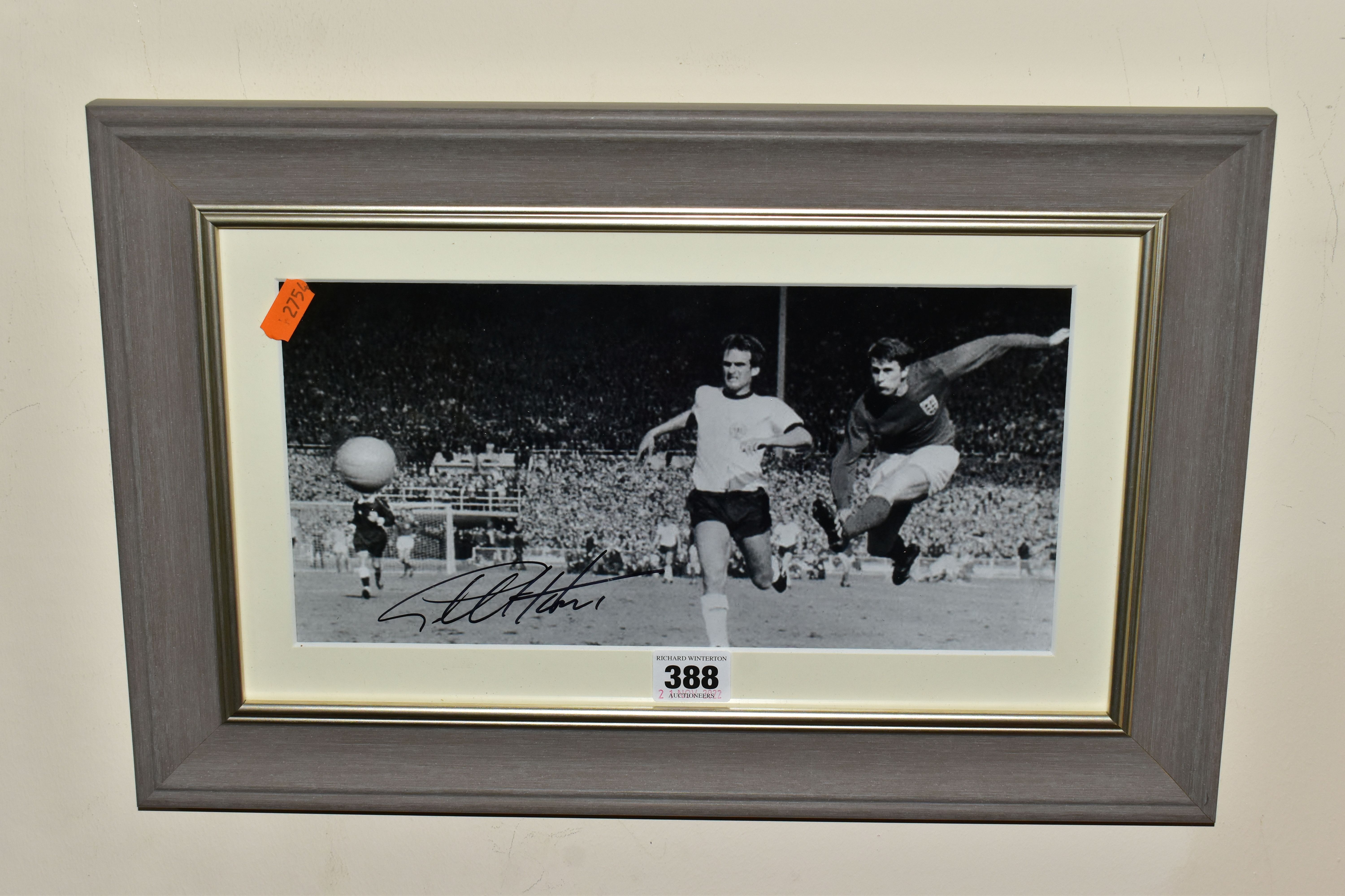 A SIGNED PHOTOGRAPH OF GEOFF HURST SCORING THE FOURTH GOAL IN DURING ENGLANDS 1966 WORLD CUP WIN,