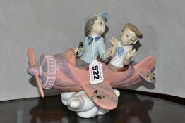 A LLADRO 'DON'T LOOK DOWN' SCULPTURE, model no 5698, depicting two figures in an aeroplane, sculptor